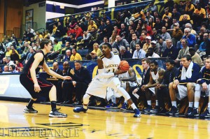 Redshirt freshman Tavon Allen scans the court in a game against Northeastern University at the Daskalakis Athletic Center Jan. 8. The Dragons went on to lose the game in overtime 58-63, which was made possible by a very late game-tying three by the Huskies.