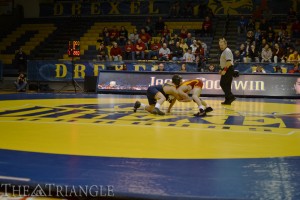 Freshman Jacob Goodwin, who competes in the 125-lb. weight class, handles his opponent in a wrestling match at the DAC.