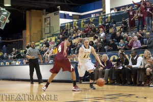 Senior guard Hollie Mershon dribbles by a defender in a contest against the Saint Joseph’s University HawksNov. 14. The Dragons fell to their city rival 47-45 despite Mershon’s 19 points and 4 rebounds.