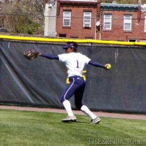 Junior center fielder Comfort Ahonkhai throws in a relay from the warning track in the outfield. Ahonkhai was the leadoff hitter in both games against Charotte and went 2-6 with one walk, one HBP, one RBI and one run.