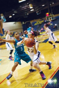 Freshman shooting guard Meghan Creighton is guarded closely by a UNCW defender in the Dragons’ 59-47 victory over the Seahawks Feb. 19 at the DAC.