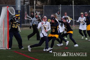 Drexel senior attack Alyse Maiden carries the ball against La Salle University in the Dragons’ 12-6 win over the Explorers Feb. 20 at Vidas Field.