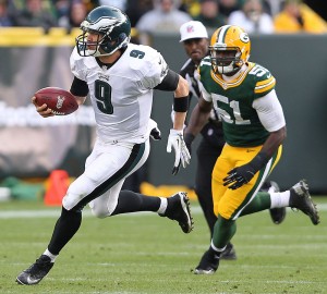 Quarterback Nick Foles of the Philadelphia Eagles scrambles for yardage against the Green Bay Packers during the third quarter at Lambeau Field in Green Bay, Wisc., Nov. 10. The Eagles beat the Packers, 27-13.