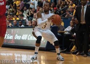 Senior guard Chris Fouch pump fakes during a game against Illinois State University Nov. 15, 2012. The Dragons avenged last year’s loss to Illinois State Nov. 12 with a 78-70 win, and Fouch led the way with 26 points.