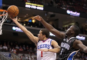 The Philadelphia 76ers’ Michael Carter-Williams drives to the basket against the Orlando Magic’s Victor Oladipo at the Wells Fargo Center in Philadelphia Dec. 3.