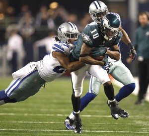 Dallas Cowboys strong safety J.J. Wilcox and cornerback Brandon Carr chase Philadelphia Eagles wide receiver DeSean Jackson at AT&T Stadium in Arlington, Tex., Dec. 29, 2013.