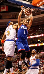 Philadelphia 76ers point guard Michael Carter-Williams dunks over New York Knicks power forward Kenyon Martin at the Wells Fargo Center in Philadelphia Jan. 11.