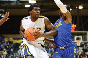 Frantz Massenat drives against Delaware during the 2013-14 regular season. (Ken Chaney - The Triangle)