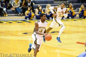 Senior Frantz Massenat dribbles up the court — with junior forward Kazembe Abif following closely behind — during Drexel’s 61-50 victory over the University of North Carolina Wilmington Feb. 2 at the DAC. The point guard finished the game with 15 points.