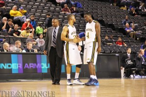 Seniors Chris Fouch and Frantz Massenat stand with head coach James ‘Bruiser’ Flint near the end of Saturday’s 90-81 loss to Northeastern in the first round of the CAA tournament. It was the veteran guards’ last game as Drexel Dragons.