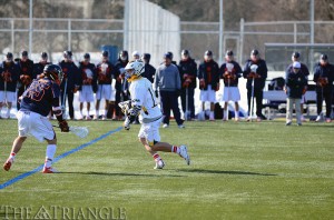 Freshman midfielder Nick Valentino rushes down field in the team’s season opener Feb. 16 versus Virginia. Valentino has notched three goals this season.