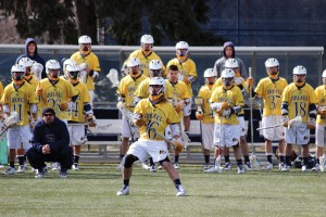 Junior midfielder Nick Saputo, No. 16, possesses the ball earlier this season in an 18-12 victory over Robert Morris University March 1. Saputo and the Dragons have won four straight after Saturday’s 13-9 victory over University of Massachusetts. (Miranda Shroyer)