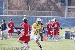 No. 31 Markel Nelson, a freshman defenseman, looks down field versus Robert Morris. Nelson and the men's lacrosse team won an awe-inspiring triple overtime game against Penn State University April 5. (Miranda Shoyer)