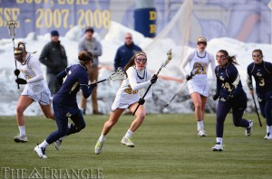 Sophomore midfielder Emily Duffey (center) makes a run versus George Washington University on February 16. Duffey has racked up nine goals and three assists in ten games this season, including the Dragons’ first of the game versus Penn State Wednesday.