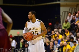 Freshman guard Major Canady eyes up the court at the Daskalakis Athletic Center this past season. Canady will be one of only five returning Dragons playing in this upcoming season. (Ken Chaney - The Triangle)