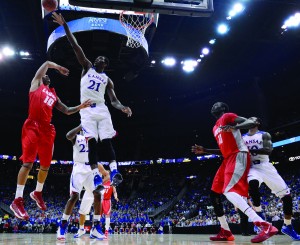 Kansas University’s Joel Embiid gets a monster block on New Mexico University’s Kendall Williams in the first halfof an 80-63 victory over NMU. Plays like these drove scouts wild about his unique mixture of athleticism and size, and most mock drafts have Embiid going number one overall to the Cleveland Caveliers. (Rich Sugg - MCT Campus)