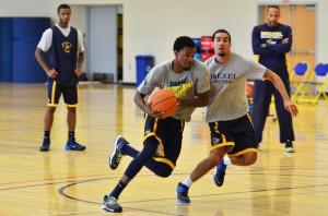 Junior guard Tavon Allen drives against freshman guard Sammy Mojica, Jr., in practice Aug. 19. (Ken Chaney - The Triangle)