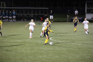 Then-junior forward Melissa Chapman dribbles the ball upfield last Sep. 6 against Liberty University. The Dragons lost that game, 3-0, en route to a 7-10-1 record on the year. Chapman will attempt to lead the women’s soccer team to a better record this season starting Aug. 22 against Villanova University. (Ajon Brodie - The Triangle)