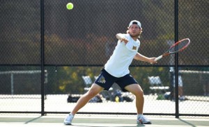 Senior Dan Hansen returns a shot during the Saint Joseph's Invitational. (Photo Courtesy - DrexelDragons.com)