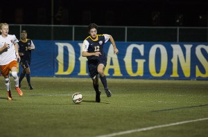 Senior John Grosh charges up the field during an early season matchup against Princeton University. This week, John Grosh held the offense together, with a goal and an assist against College of Charleston and an another assist against James Madison University. (Ken Chaney - The Triangle)