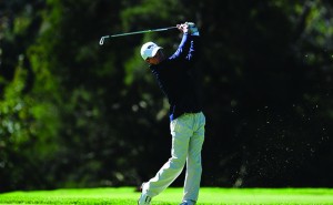 Junior Chris Crawford chips from the fairway during the Patriot Invitational. Crawford played well all weekend before a bad shot on 17 cost him the lead. (Photo courtesy-Drexeldragons.com)