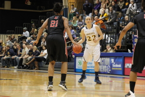 Point guard Meghan Creighton eyes up the Northeastern University defense on January 31, 2014. (Ajon Brodie - The Triangle)