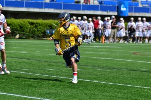 Jules Raucci looks for a teammate during the Dragons' NCAA tournament game against University of Denver. (Ken Chaney - The Triangle)