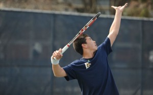 Senior Alex Fioravante prepares to serve during the Dragons’ matchup against the University of Maryland Baltimore County. The men’s team fell to UMBC 4-0 while the women’s team won 5-2. 