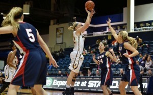 Senior forward Jackie Schluth takes a jumper against University of Pennsylvania. Schluth has emerged as a huge piece to the Dragons’ second-place squad, and was honored with the Colonial Athletic Association player of the week award this week. (Photo courtesy - Drexeldragons.com)
