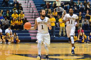 Senior guard Freddie Wilson dribbles down the floor Feb. 26. (Ken Chaney - The Triangle)