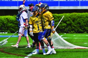 Cole Shafer and Robert Frazee celebrate a goal by Shafer in the 2014 NCAA tournament against Denver University. (Ken Chaney - The Triangle)