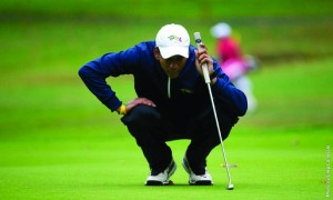 Sophomore golfer Yoseph Dance sizes up a putt earlier this season. Dance and the Drexel golf team finished 11th at the Liberty Spring Invitational. (Photo Courtesy - Drexel Dragons)