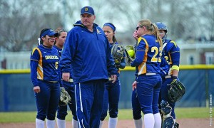 Carl Taylor, pictured third from left, will take over as the full-time head coach of the Drexel University softball team after serving as interim coach since February. (Photo courtesy - Drexel Dragons)