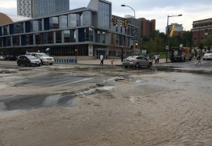 The scene at the water main break at the corner of 33rd & Market streets. (Adam Hermann - The Triangle)