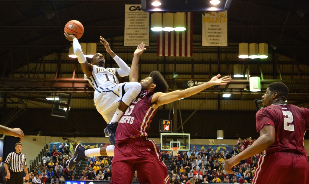 Tavon Allen goes up for a shot against St. Joe's University's DeAndre Bembry Nov. 17. (Ken Chaney - The Triangle)