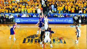 Drexel and Penn players jump for the tip ball Nov. 18 2008, during Penn’s first-ever visit to the Daskalakis Athletic Center. Drexel won, 66-64.  (Photo courtesy - Drexel Dragons)