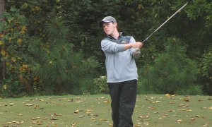 Photo courtesy Drexeldragons.com Freshman Michael Cook watches a shot during the Terrapin Invitational in Baltimore, MD.  Cook kept up with senior Chris Crawford, ending the tournament just a stroke behind Crawford.