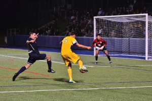 Sophomore midfielder Erik Alexandersson prepares to take a shot during the Dragons’ matchup against the University of Pennsylvania Sept 15. The Dragons won that game, 1-0. (Ken Chaney - The Triangle)