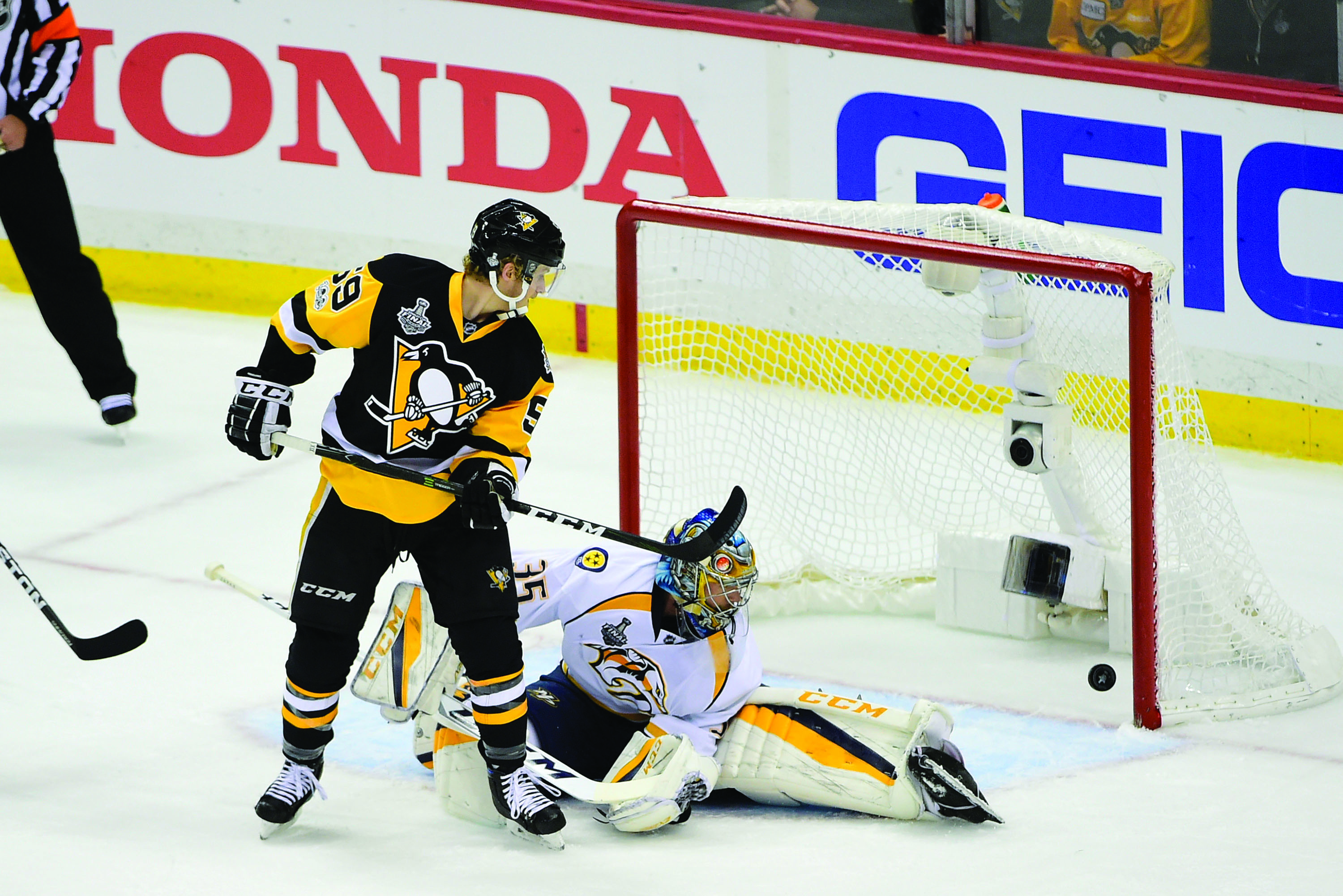 Nashville Predators goalie Pekka Rinne (35) and Pittsburgh Penguins center Jake Guentzel (59) watch the puck cross the goal line during game one of the National Hockey League Stanley Cup Finals on Monday, May 29, 2017 at PPG Paints Arena in Pittsburgh, Pa. (Eric Canha/Cal Sport Media/Zuma Press/TNS)