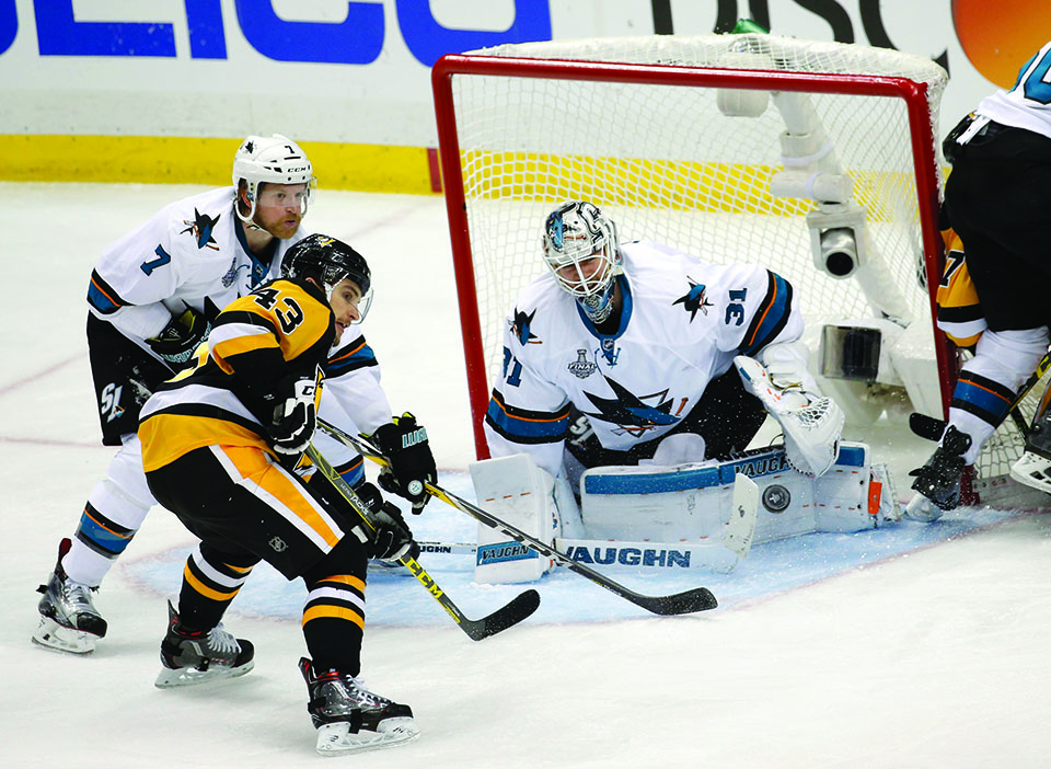 The San Jose Sharks' Paul Martin (7) helps goaltender Martin Jones (31) make a save against the Pittsburgh Penguins' Conor Sheary (43) in the third period of Game 5 of the Stanley Cup Final at Consol Energy Center in Pittsburgh, Pa., on Thursday, June 9, 2016. The Sharks won, 4-2, to cut the Pens' series lead to 3-2. (Josie Lepe/Bay Area News Group/TNS)